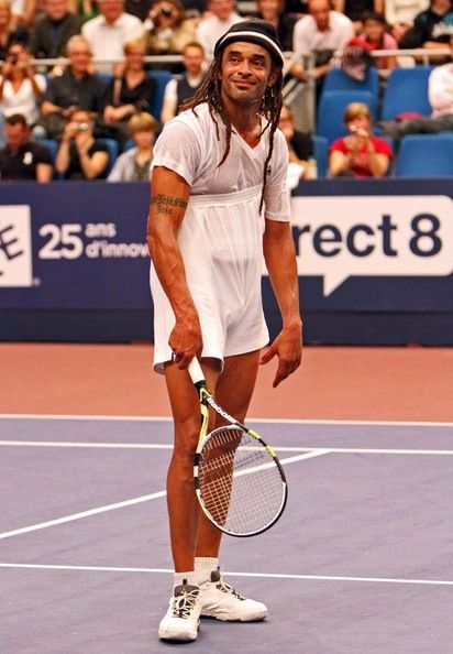 Tennis dress worn over a game-ready stance